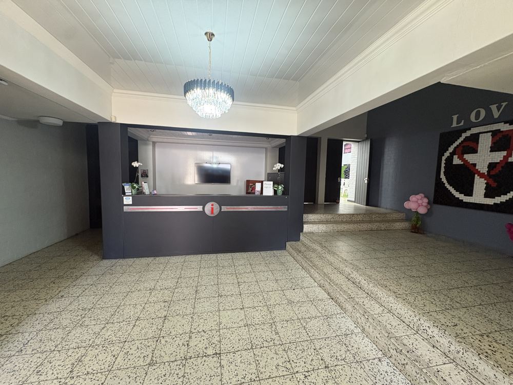 Reception foyer with front desk and chandelier