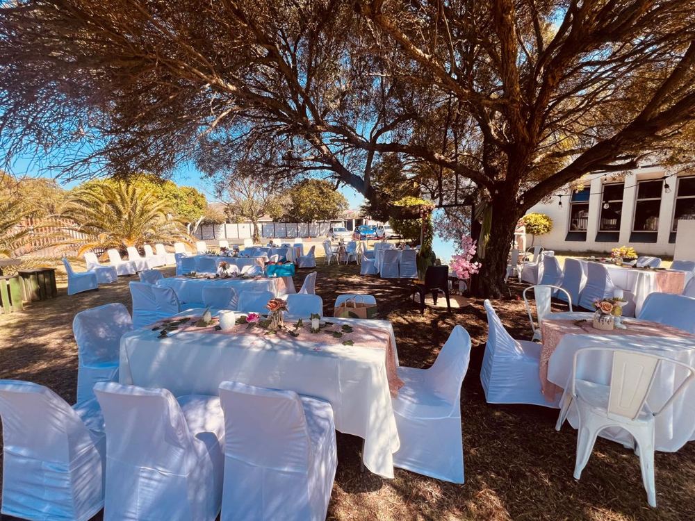 Outdoor Garden at The Love Church, set up with white chair covers and tables